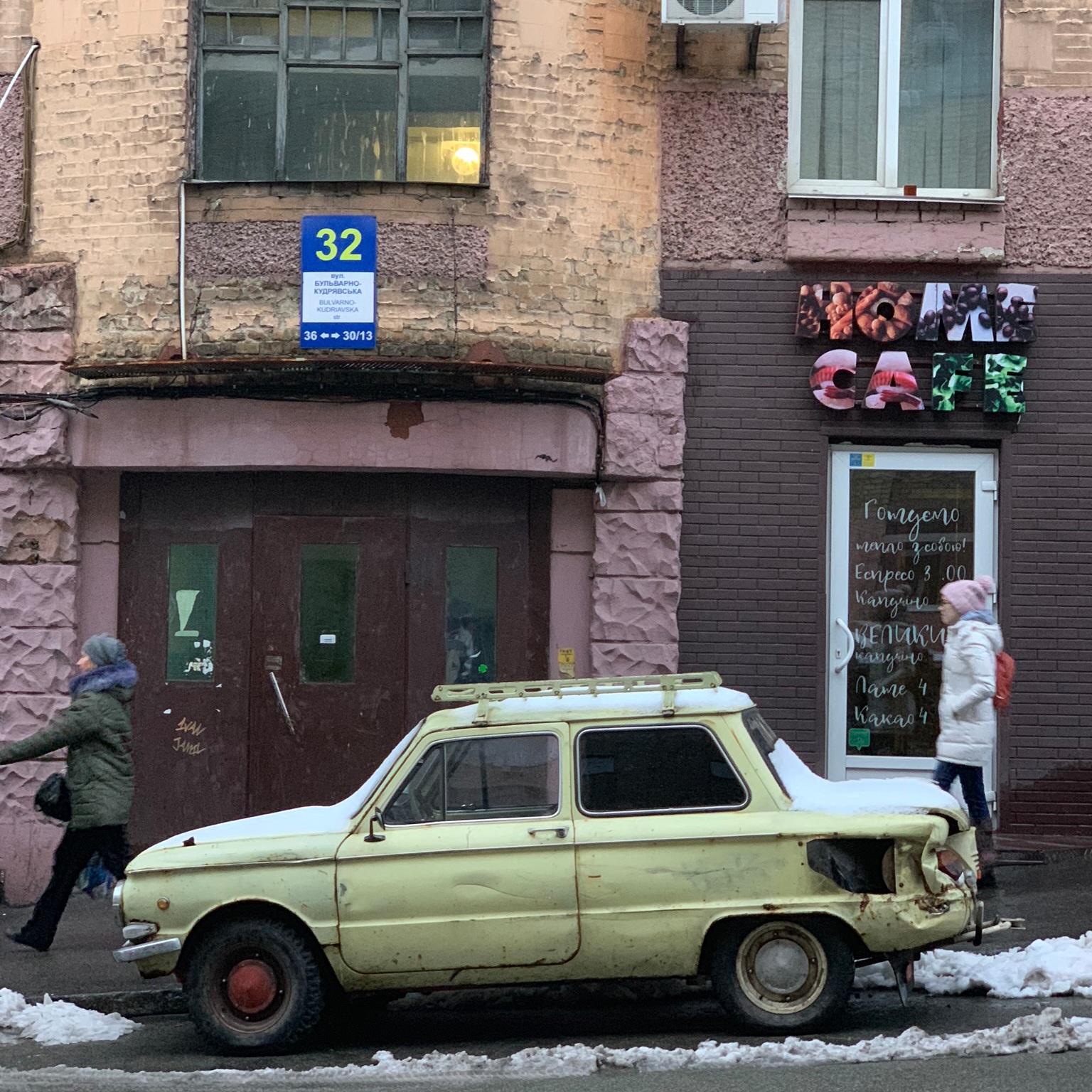 Old car next to new cafe. Stark contrasts here.