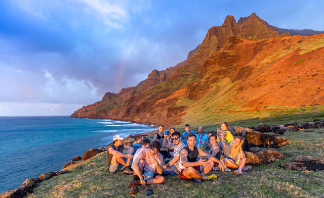 A group of people are celebrating a birthday in Kauai