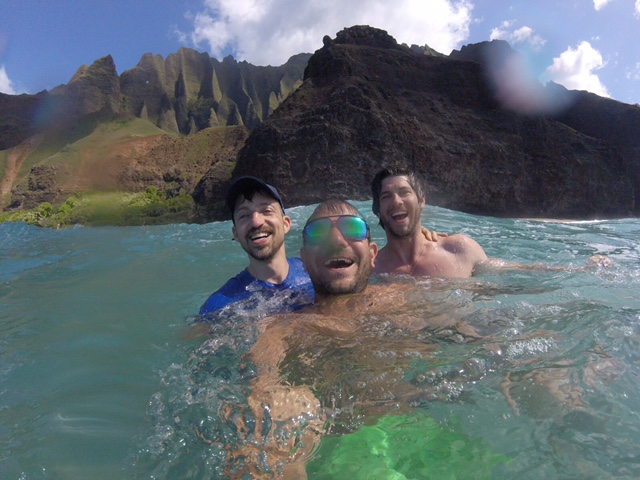 Three men in the water near Kauai
