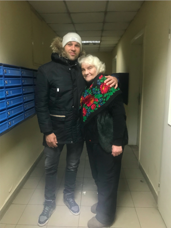 Peter Santenello hugs old woman in Kyiv, Ukraine